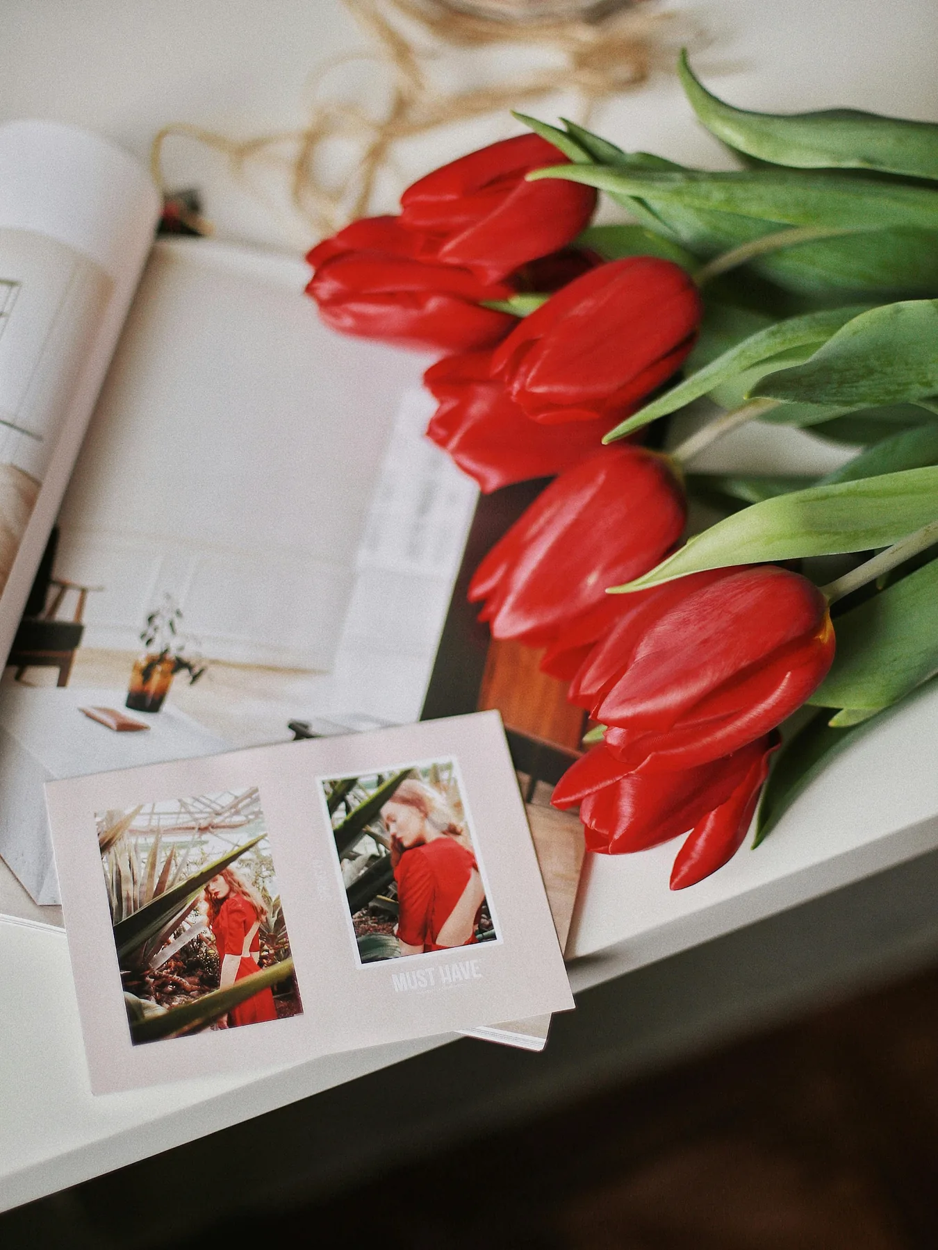 Photo prints and fresh tulips — printed memories to hold